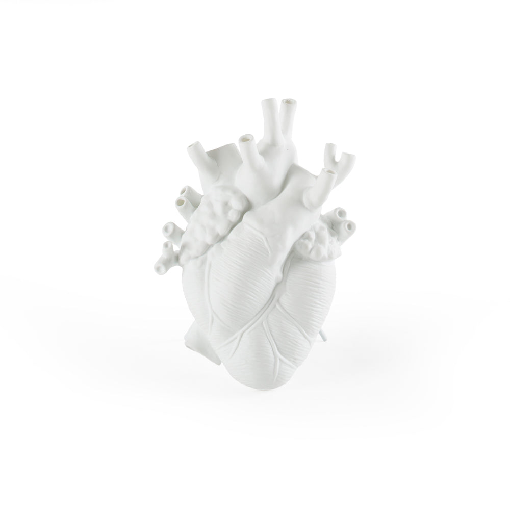 Front view of Seletti Love in Bloom White Porcelain Heart Vase