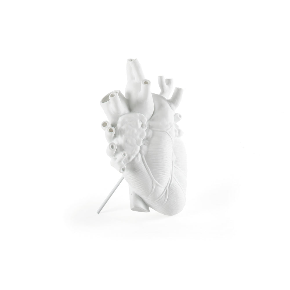 Side view of Seletti Love in Bloom White Porcelain Heart Vase