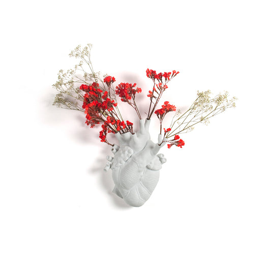 Seletti Love in Bloom White Porcelain Heart Vase displaying flowers